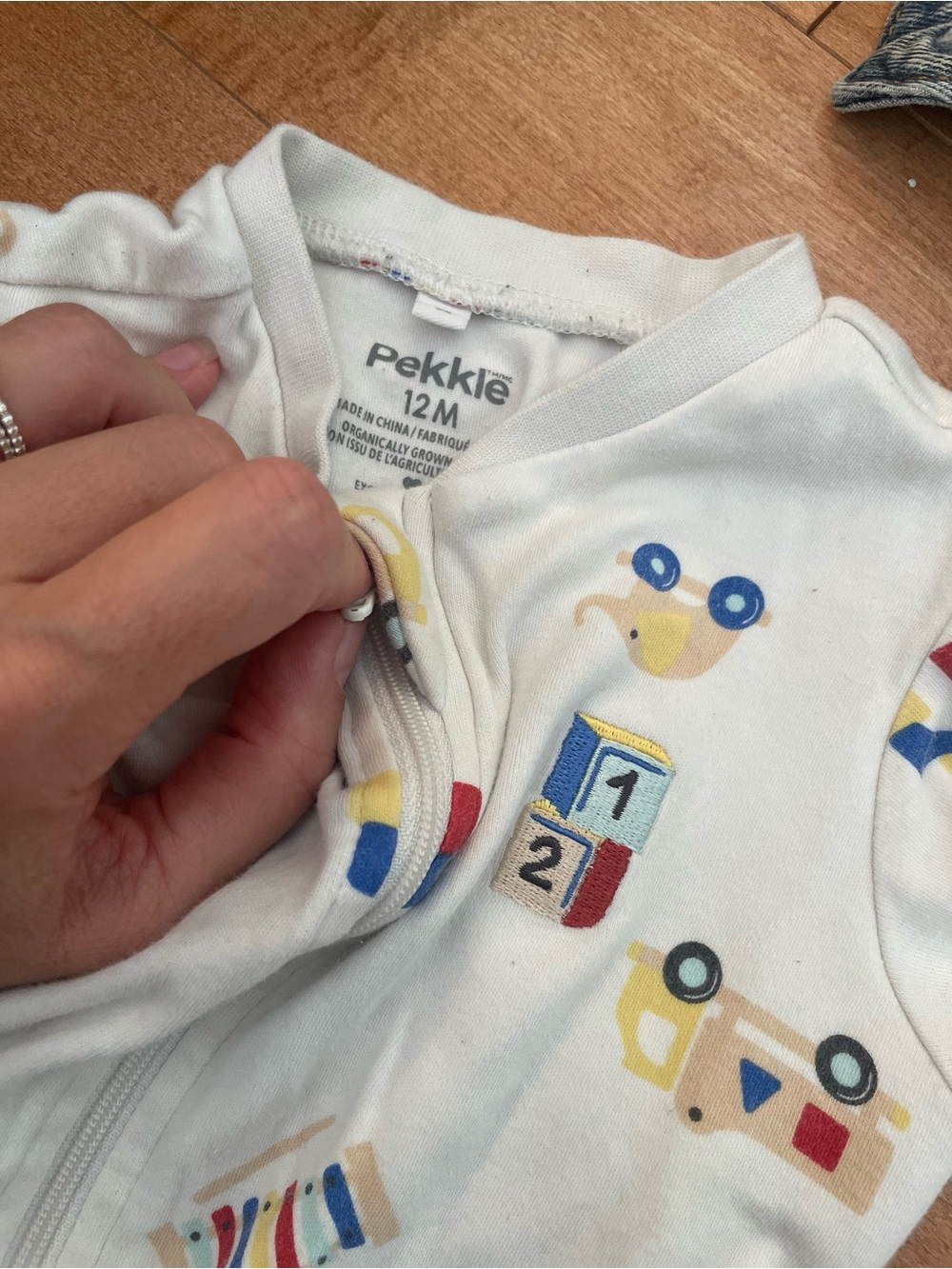 Pekkle 12M White Footed One-Piece with Toy Print
